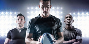 Three-Rugby-Players-Holding-Ball